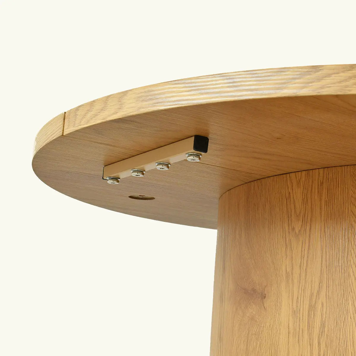 Close-up view of wooden Dwen Modern Large Oval Dining Table base detail showing craftsmanship.