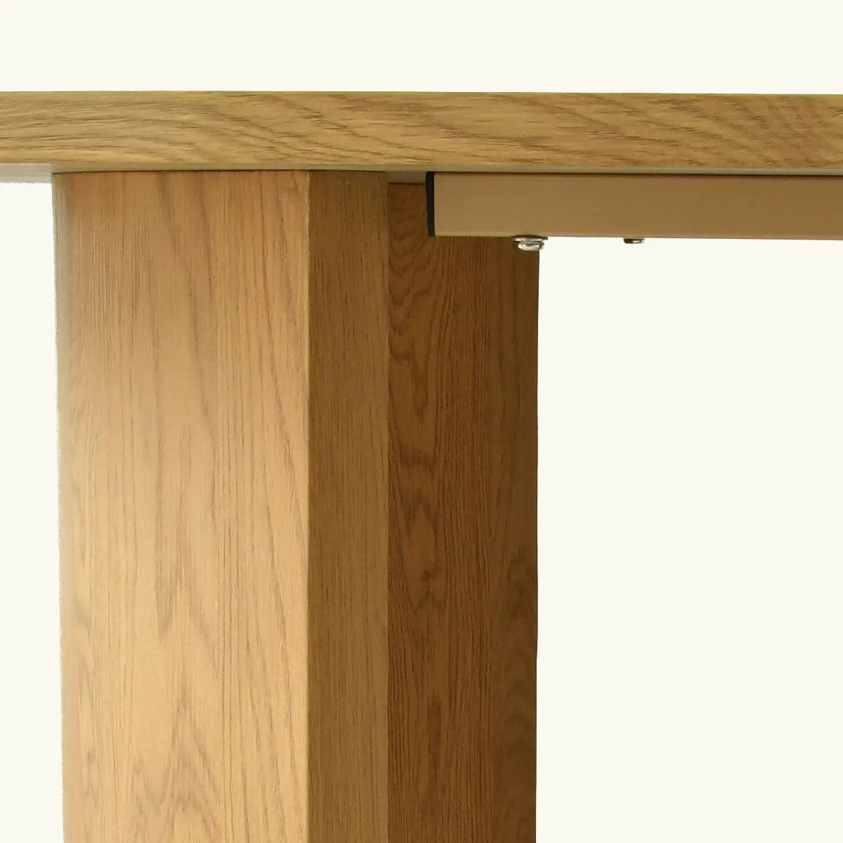 Dwen Modern Large Oval Dining Table corner detail in light oak finish, showcasing wood grain texture.