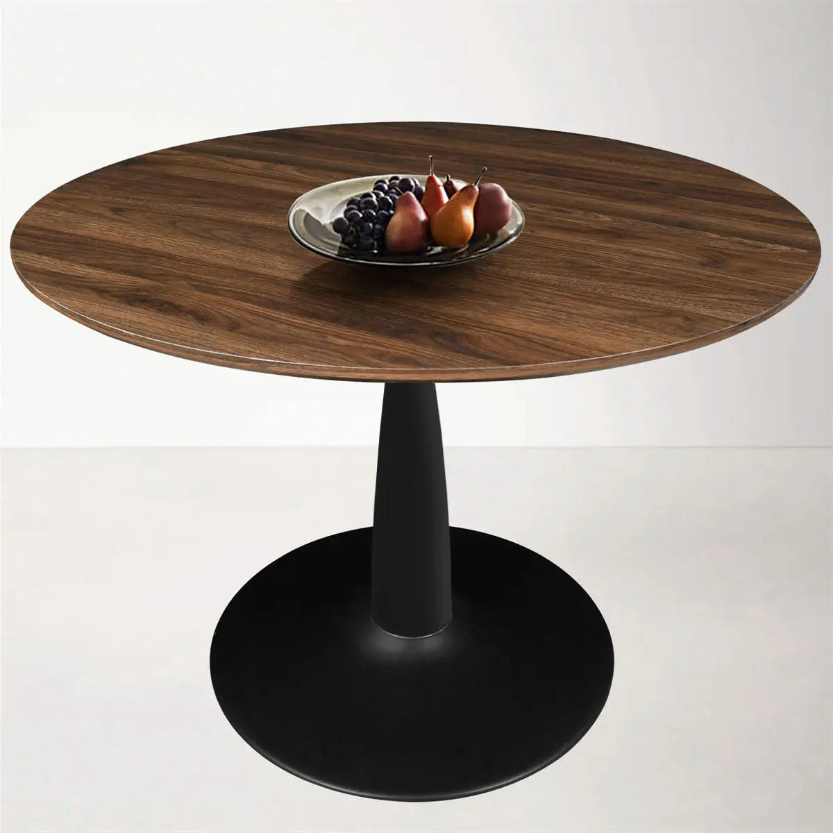 Harold Modern Round Pedestal Dining Table in minimalist design, wood top, and black base.