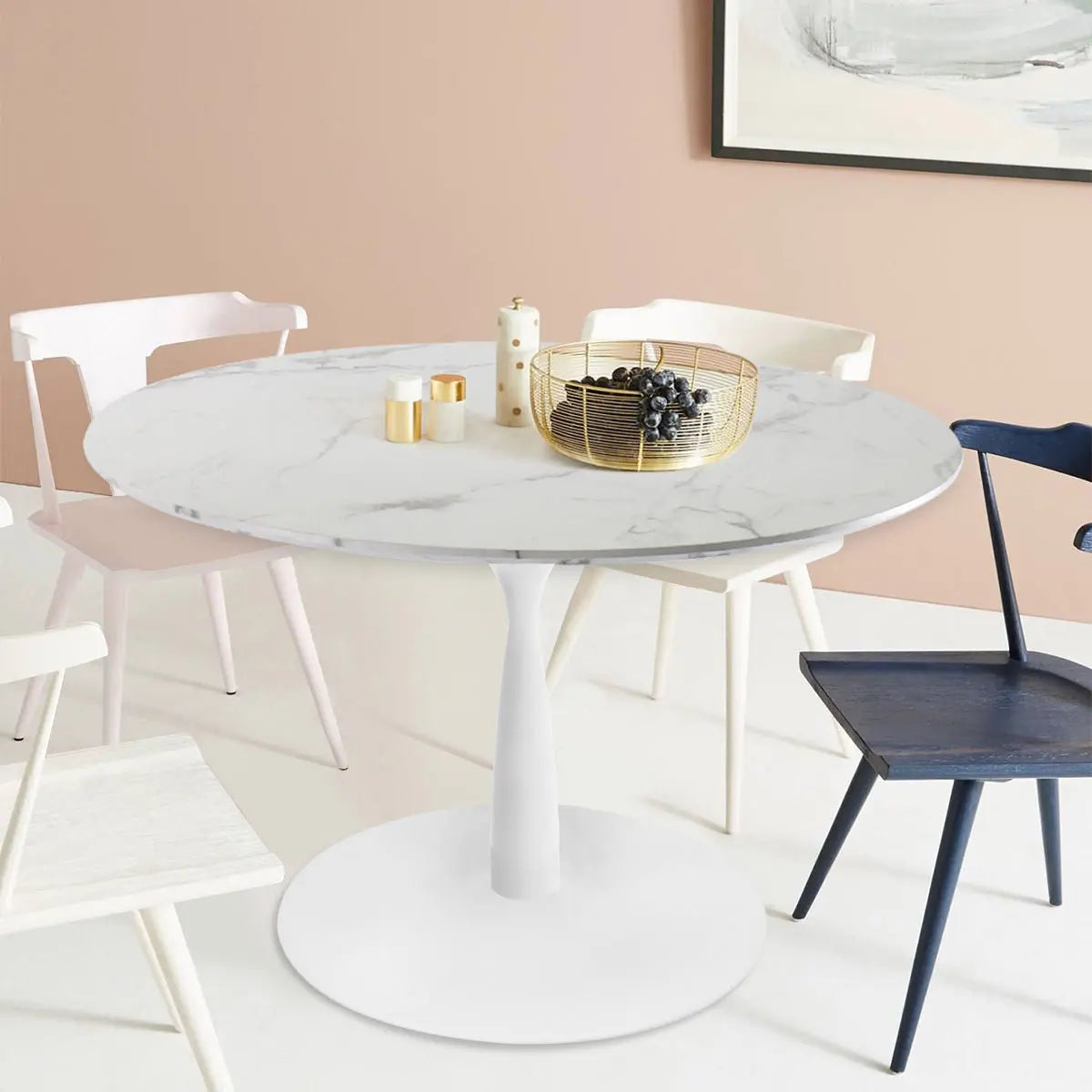 Harris Marble Top Round Pedestal Dining Table with mixed chairs, pastel wall, modern dining room.