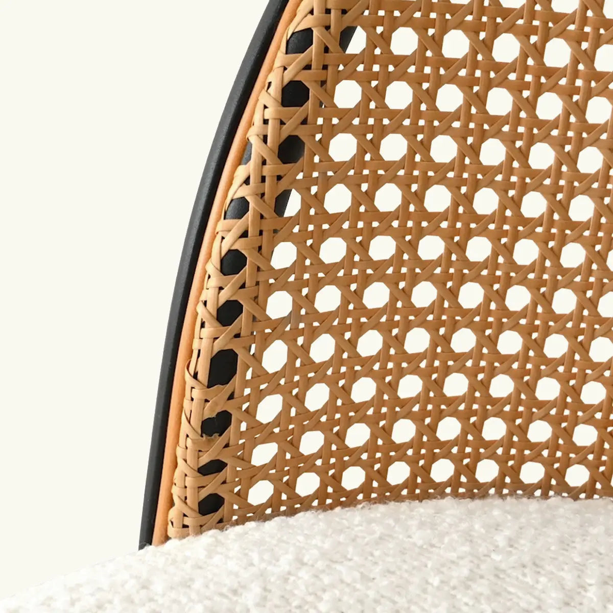 Close-up of Jules Modern Rattan Stool, intricate design, upholstered seat, minimalist style.