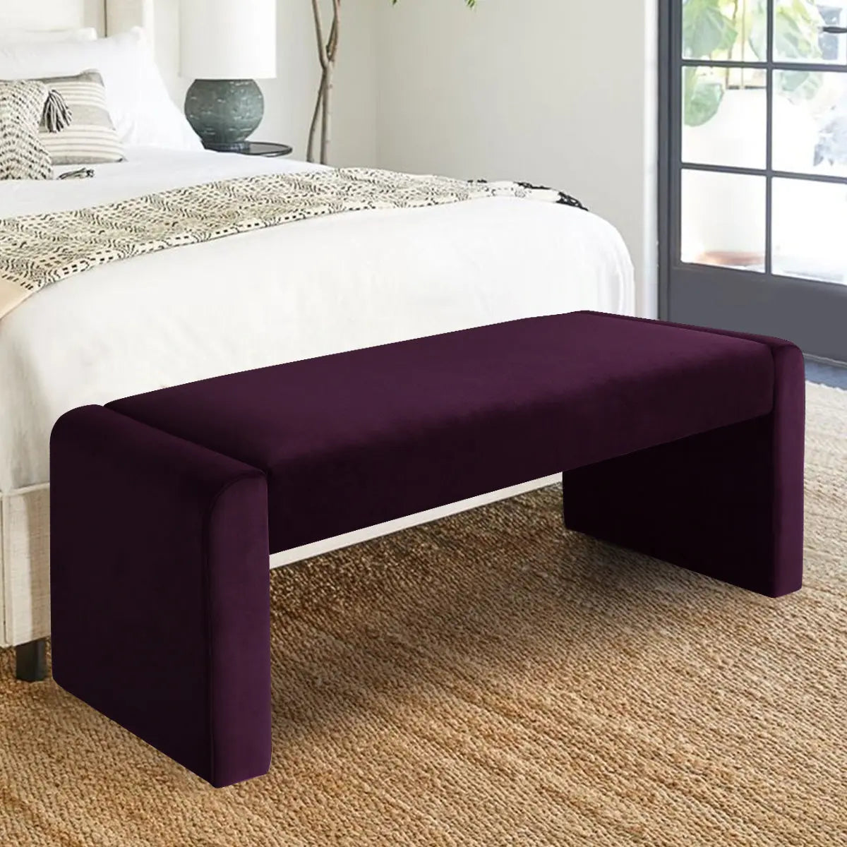 Kaia Modern Waterfall Bench in bedroom with beige rug, white bed, and gray French doors.