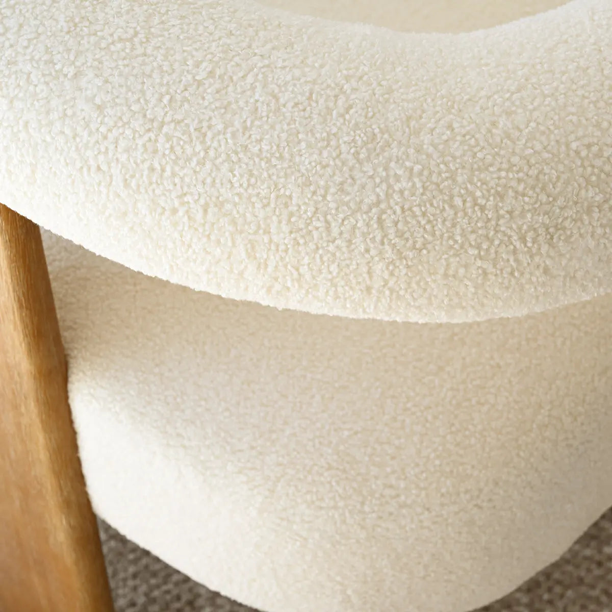 Close-up texture of Maye Beige Boucle Upholstered Living Room Chair with wooden element.