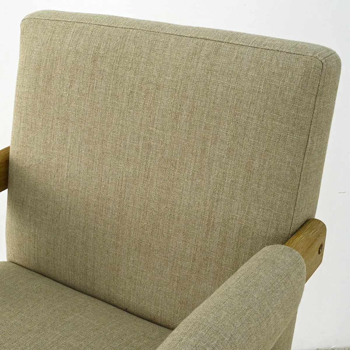 Beige fabric Morgan Mid Century Modern Counter Stool with Arms, minimalist design, light wall backdrop.