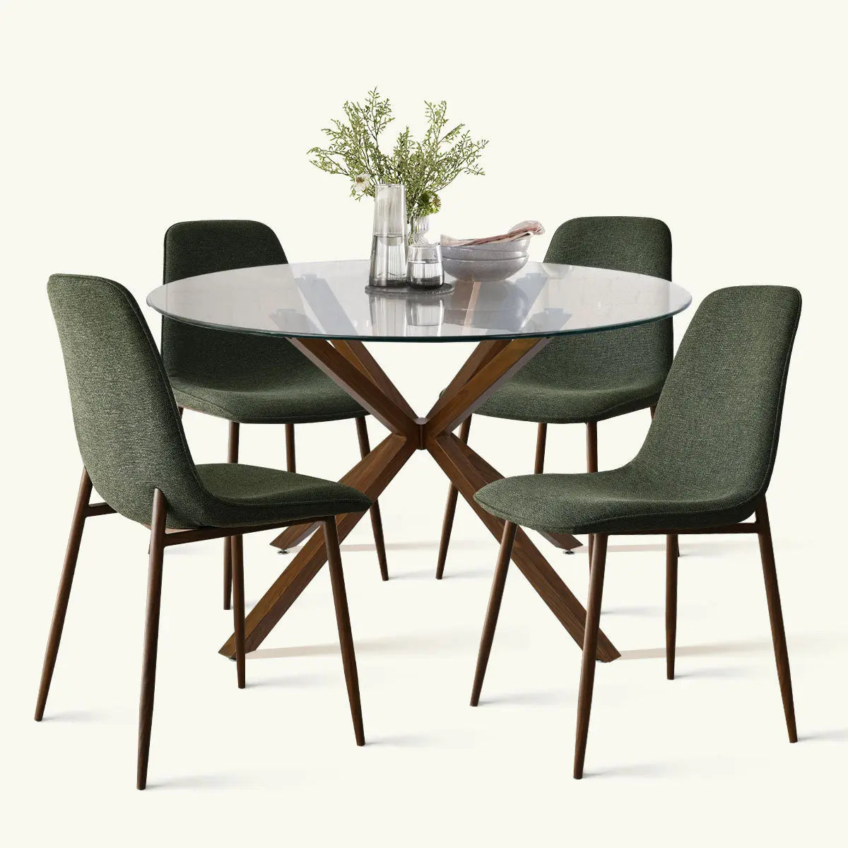 Oliver & Oslo glass round dining table set with green chairs, wooden legs, ideal for dining room.