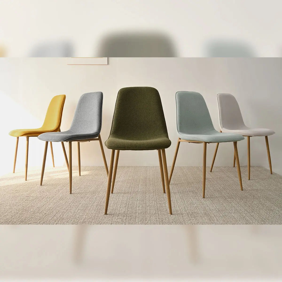 Oslo Modern Chenille Dining Chairs with Oak Legs, multi-colored, on beige carpet in dining room.