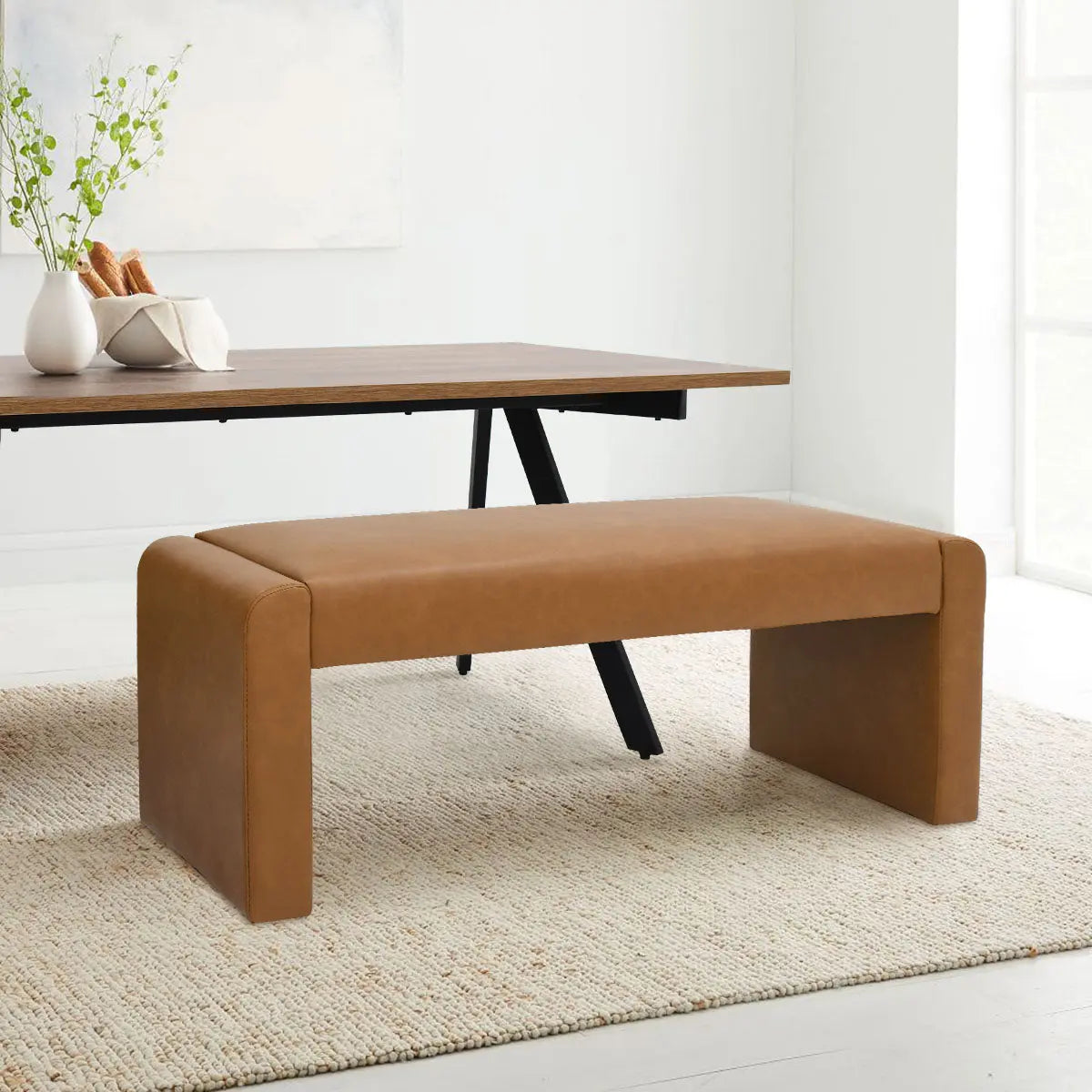 Kaia Modern Leather & Velvet Waterfall Bench in a contemporary dining room with neutral rug and table.