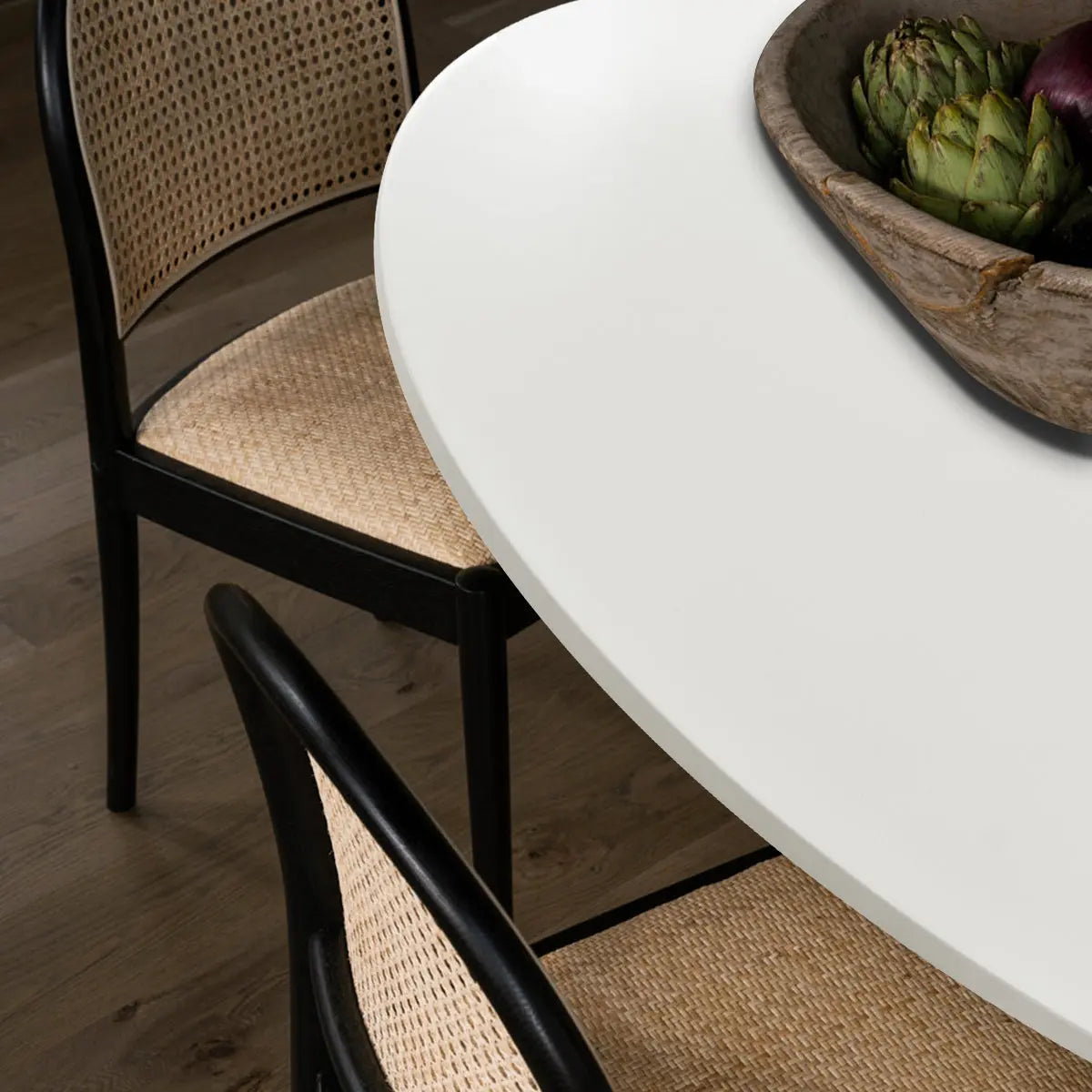 Harris Modern white dining table with wood chairs, dark flooring in dining room.