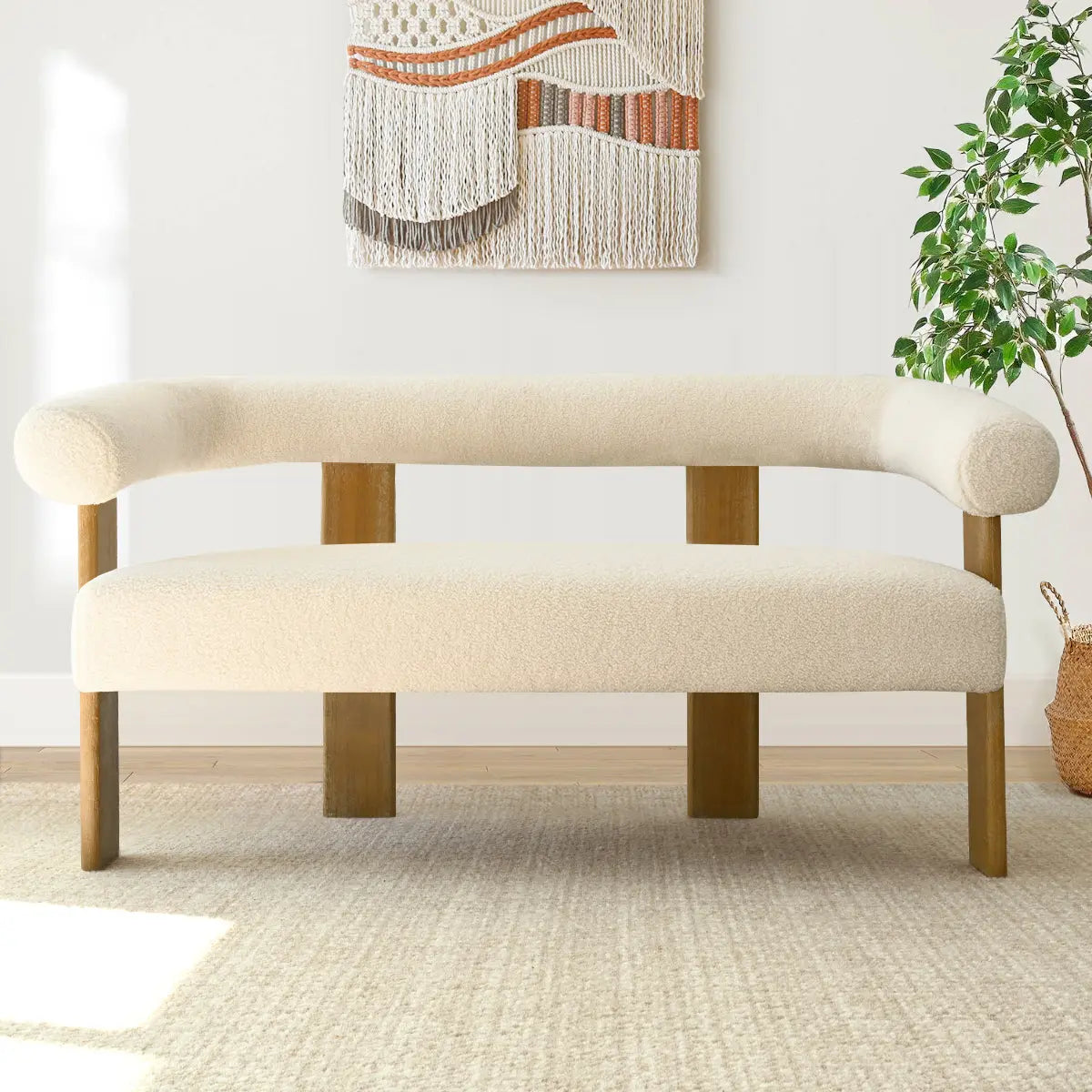 Maye Modern Beige Upholstered Loveseat Sofa in cozy living room with neutral wall hanging and rug.