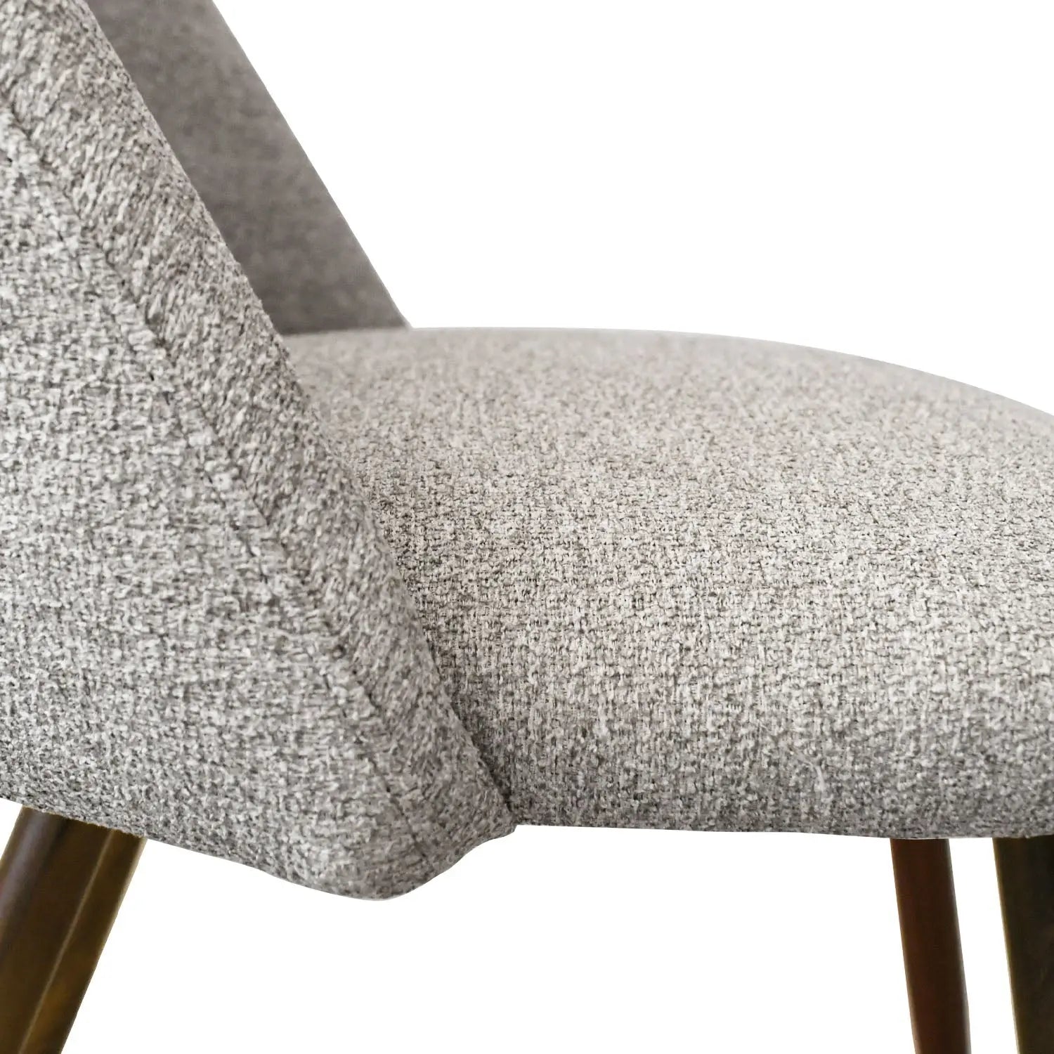 Close-up of a grey chair from Oliver & Edwin Round Glass Top Dining Table Set, fabric texture.